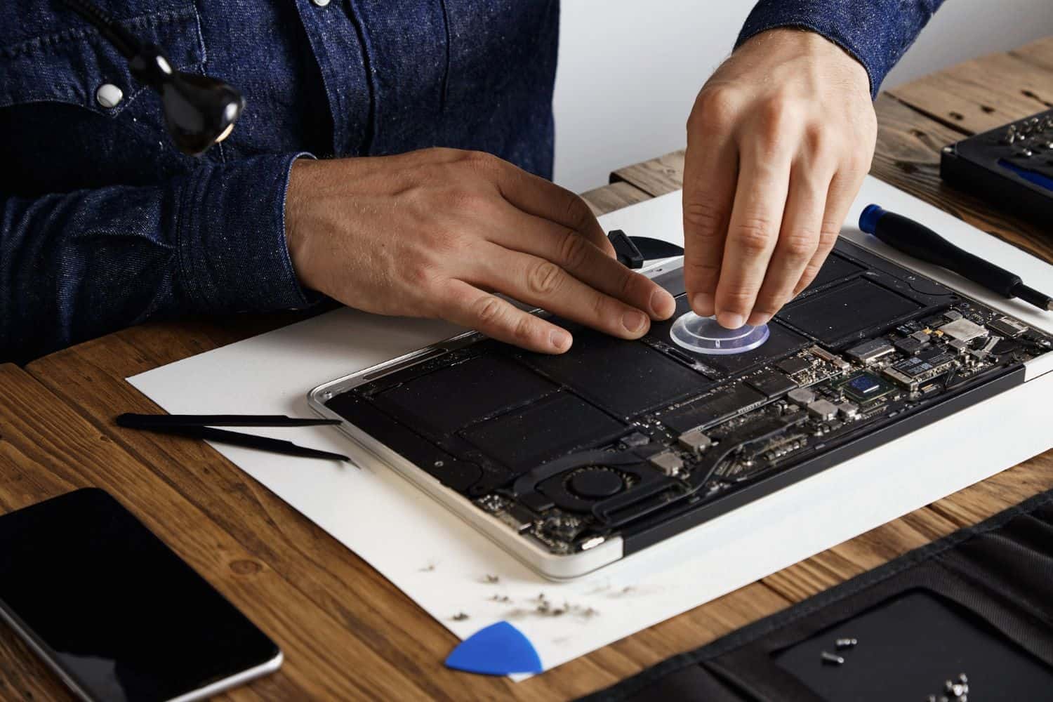 Laptop SSD upgrade Singapore – BreakFixNow technician installing SSD into laptop
