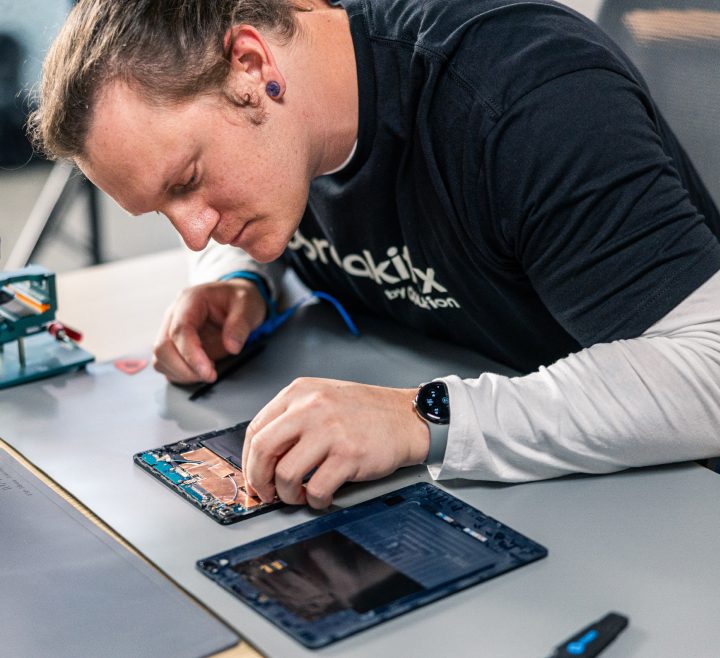 iPad Pro screen replacement and repair service showing professional technician working in Singapore