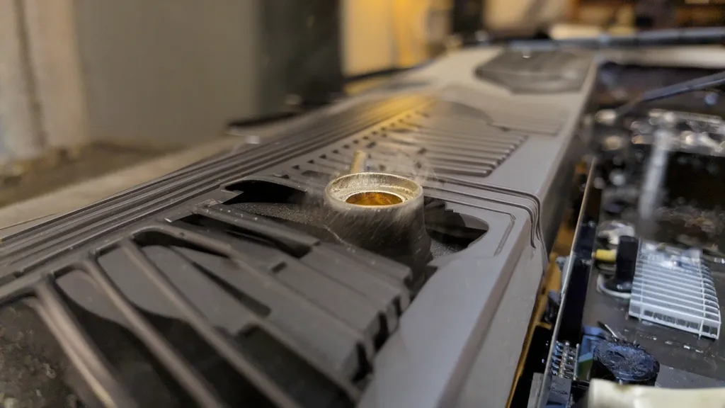 GPU fan grinding noise — worn bearing causing rattling sound